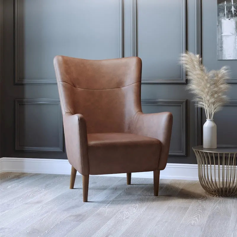 Gestoffeerde oorfauteuil met houten frame en poten