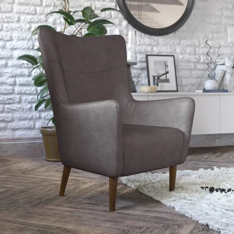 Gestoffeerde oorfauteuil met houten frame en poten